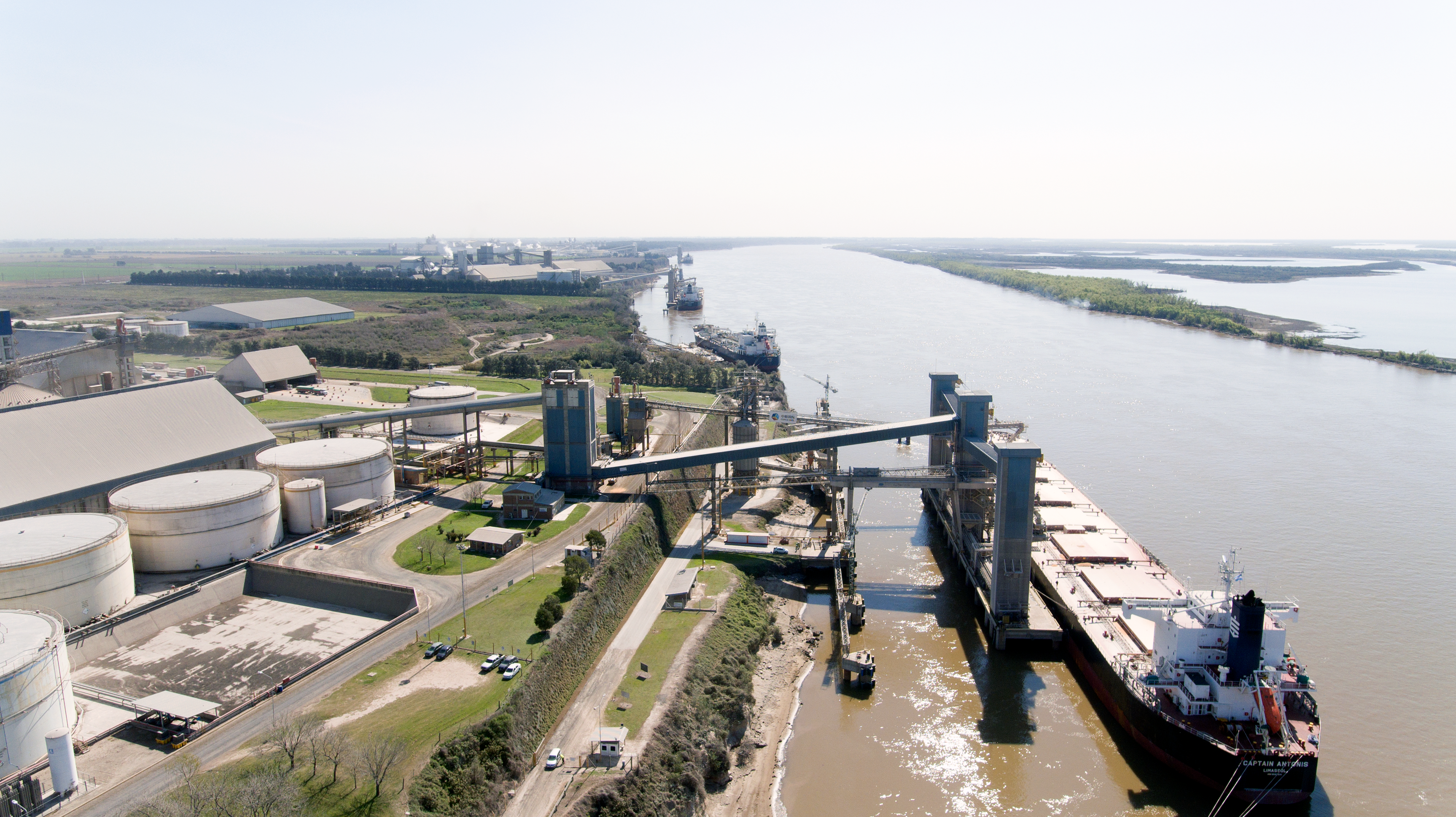 Soybeans and corn is loaded onto ships for export at COFCO's Timbues port terminal on the Parana river near Rosario, Argentina.